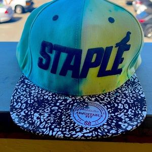 Staple Pigeon snap back hard bill hat has repair